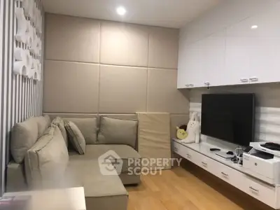 Modern living room with cozy sectional sofa and sleek entertainment unit