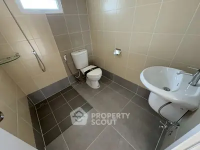 Modern bathroom with sleek fixtures and neutral tile design