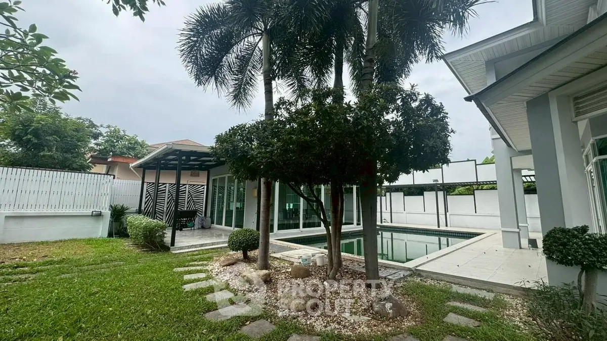 Luxurious home with private pool and lush garden, perfect for relaxation and entertaining.