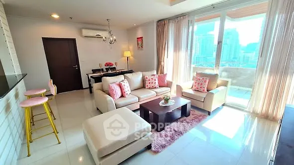 Spacious living room with modern decor and city view balcony