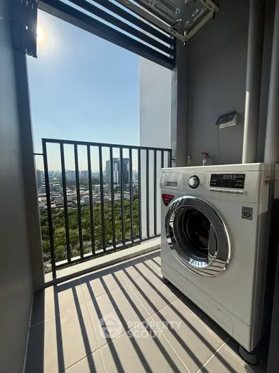 Modern apartment balcony with washing machine and stunning city view.
