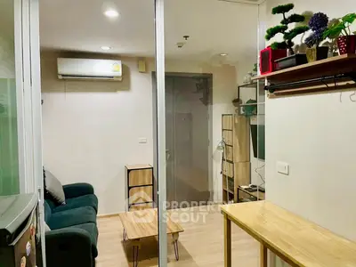 Modern living room with sleek furniture and air conditioning in a cozy apartment.