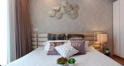 Luxurious bedroom with modern decor and plush bedding