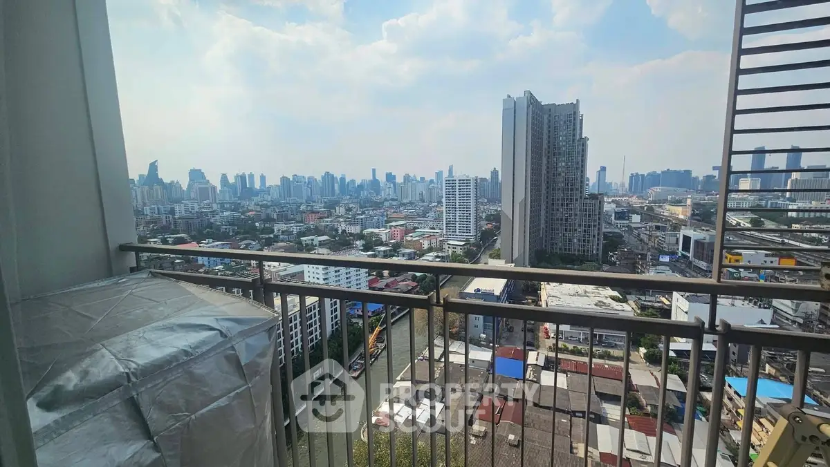 Stunning cityscape view from high-rise balcony overlooking urban skyline