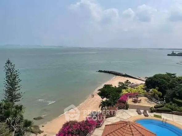 Stunning beachfront property with pool and lush gardens offering breathtaking ocean views.