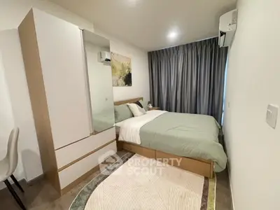 Modern bedroom with stylish decor and ample natural light