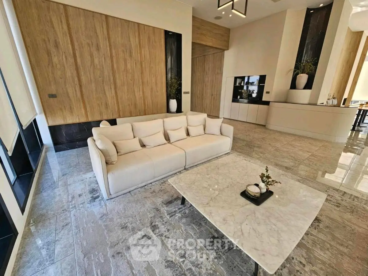Luxurious modern living room with elegant marble flooring and stylish furniture