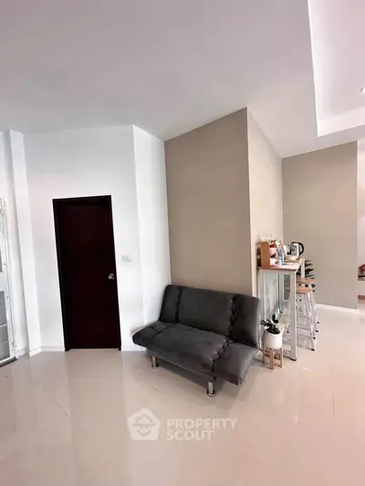 Modern living room with sleek sofa and stylish bar counter