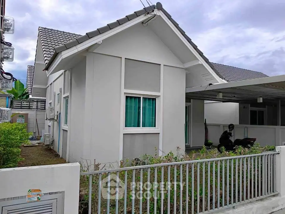 Charming single-story house with modern design and gated entrance, perfect for family living.