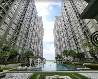 Stunning view of modern high-rise buildings with a luxurious pool and landscaped garden.