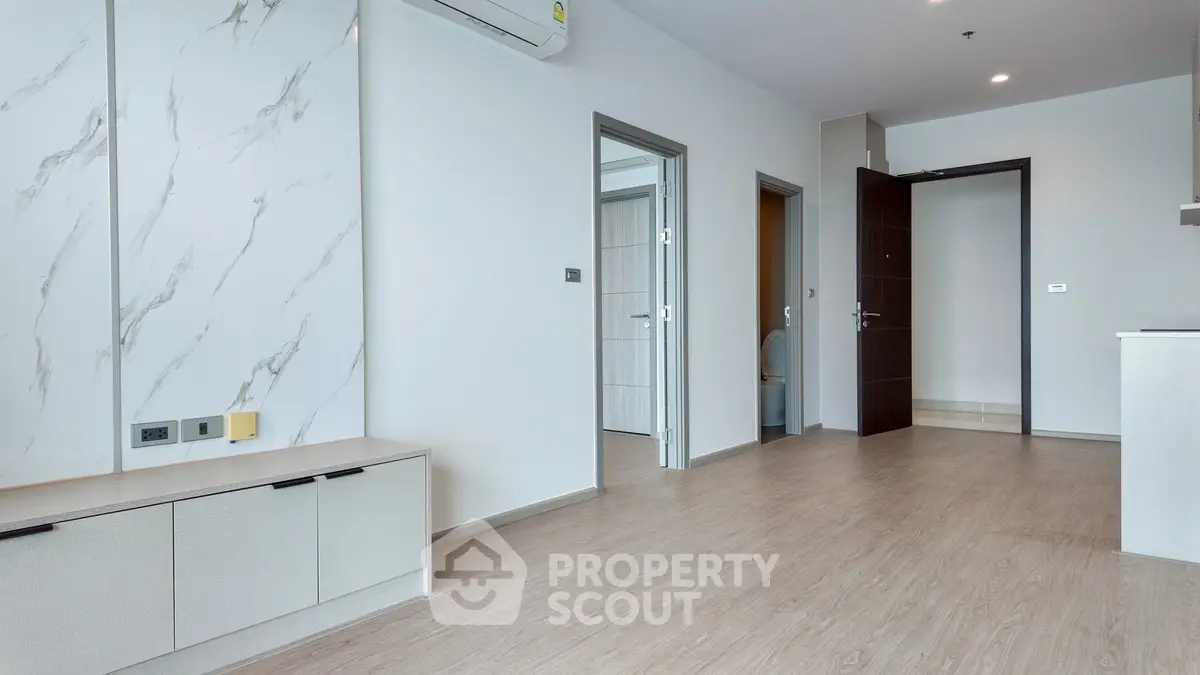 Modern apartment interior with open layout and stylish flooring