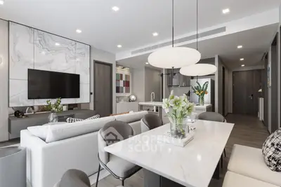Modern open-plan living room with elegant dining area and stylish decor
