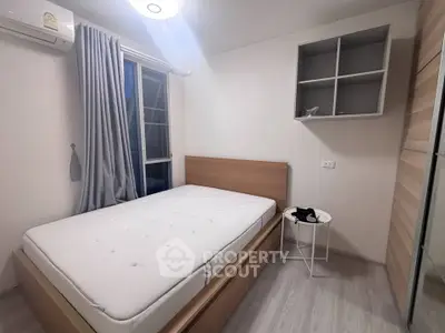 Modern bedroom with minimalist design, featuring a cozy bed, stylish curtains, and ample storage space.