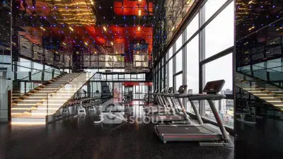 Luxurious high-rise gym with panoramic city views and modern fitness equipment.