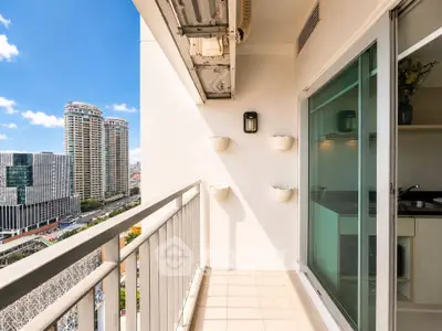 Modern apartment balcony with city view and sliding glass doors
