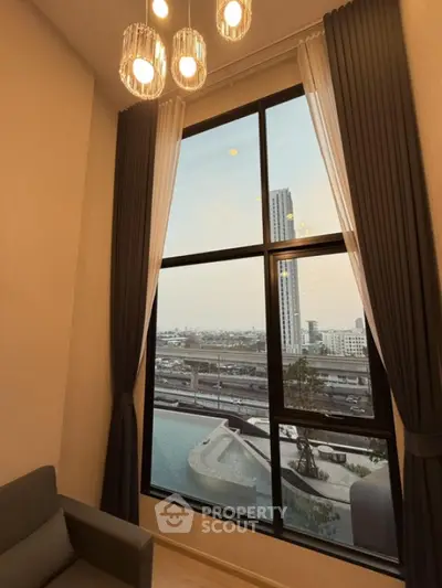 Luxurious high-rise apartment with stunning city view and elegant interior lighting.