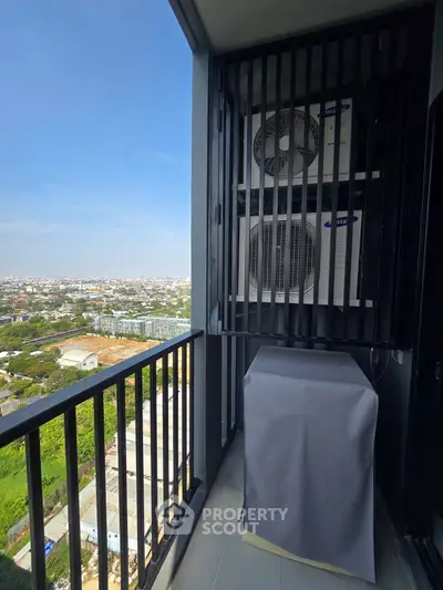 High-rise balcony with city view and air conditioning units, perfect for urban living.