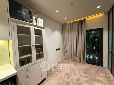 Cozy interior space with elegant curtains and stylish cabinet, perfect for modern living.