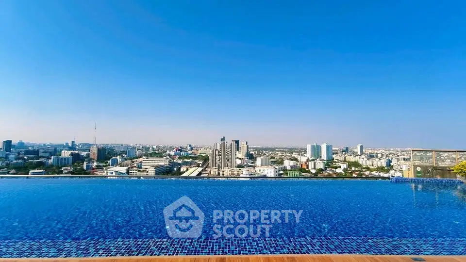 Stunning rooftop infinity pool with panoramic city skyline view