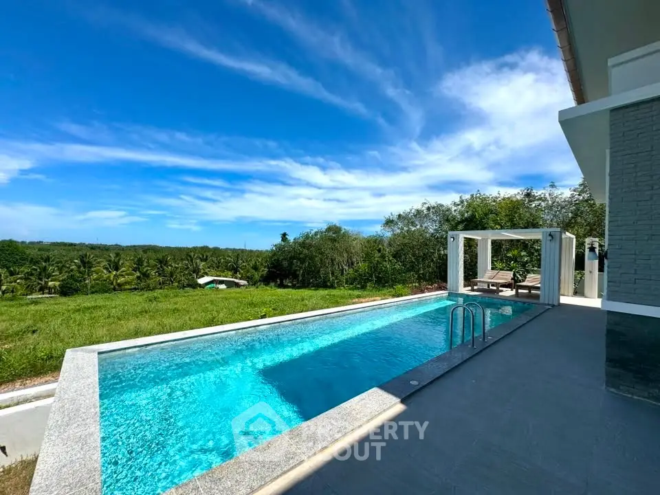 Luxurious villa with stunning private pool and panoramic countryside views, perfect for serene living.