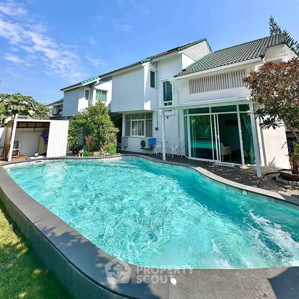 Stunning modern home with private pool and lush garden, perfect for luxurious living.