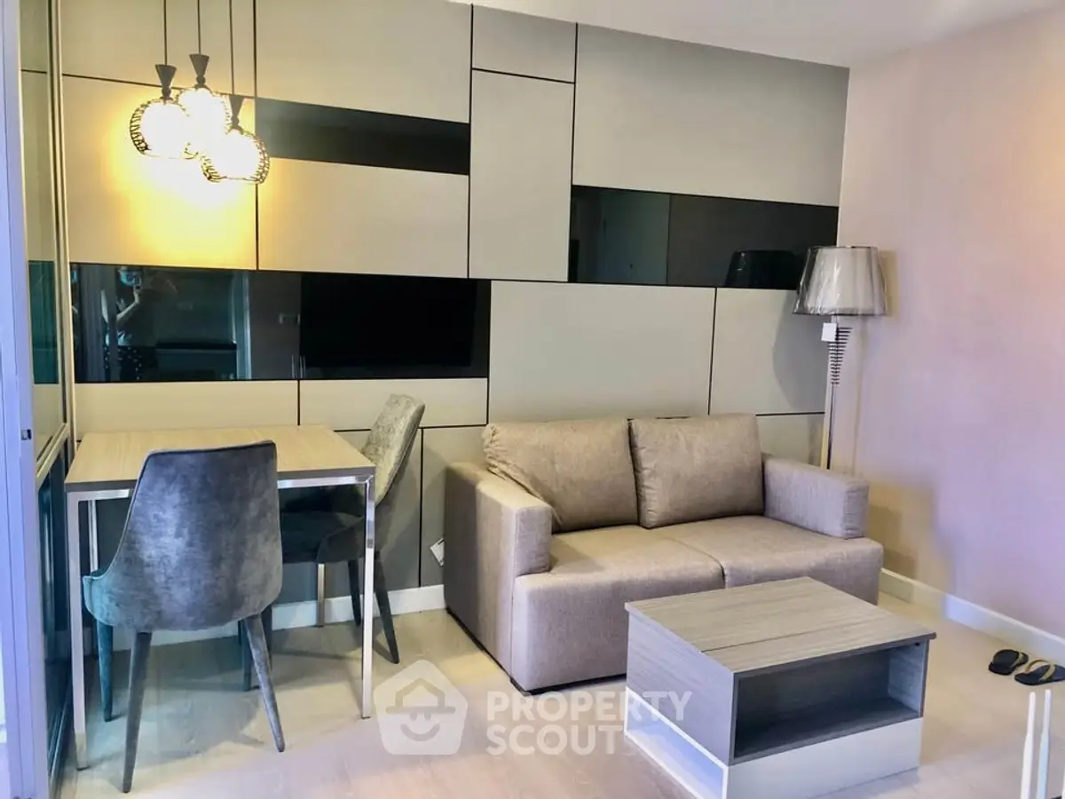 Modern living room with stylish furniture and elegant lighting in a contemporary apartment.