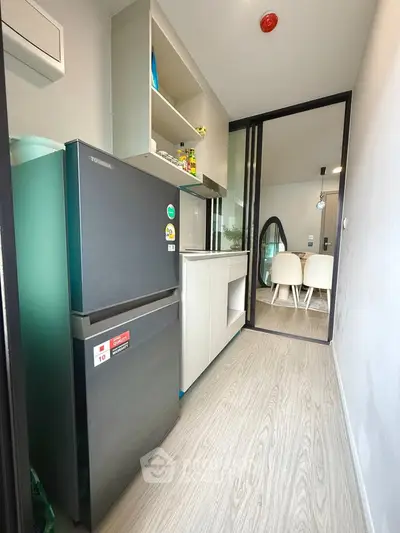 Modern kitchen with sleek appliances and open layout in a stylish apartment