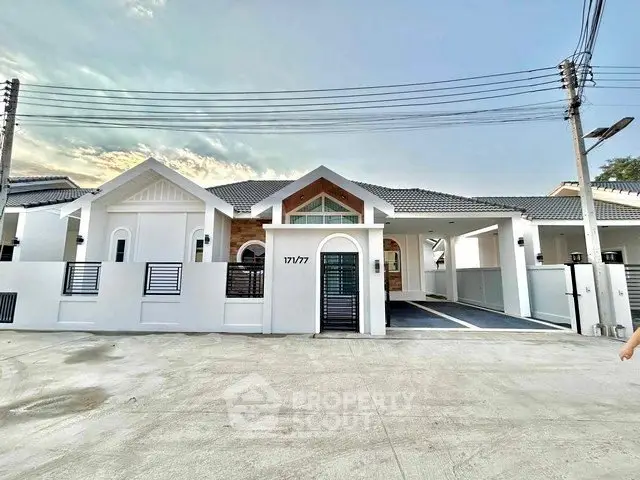 Modern single-story house with stylish facade and spacious driveway