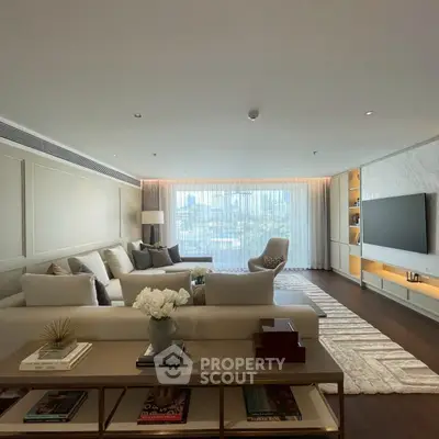 Luxurious living room with elegant decor and large window offering stunning city views.