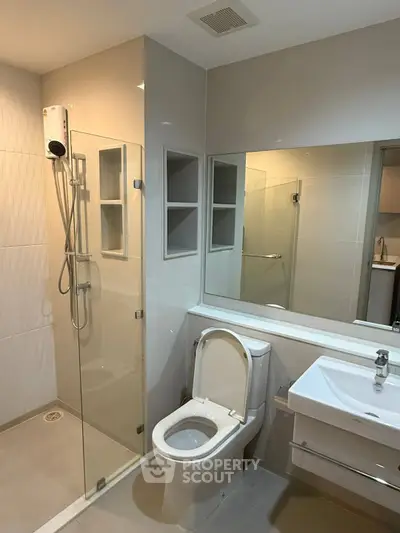 Modern bathroom with glass shower and sleek fixtures