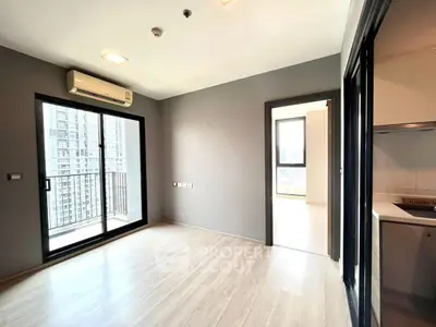 Modern apartment with balcony and sleek interior design, featuring open space and natural light.