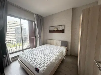 Modern bedroom with balcony view in urban apartment