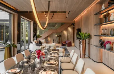 Luxurious modern living and dining area with elegant decor and open layout.