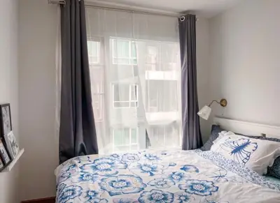 Cozy bedroom with floral bedding and modern decor