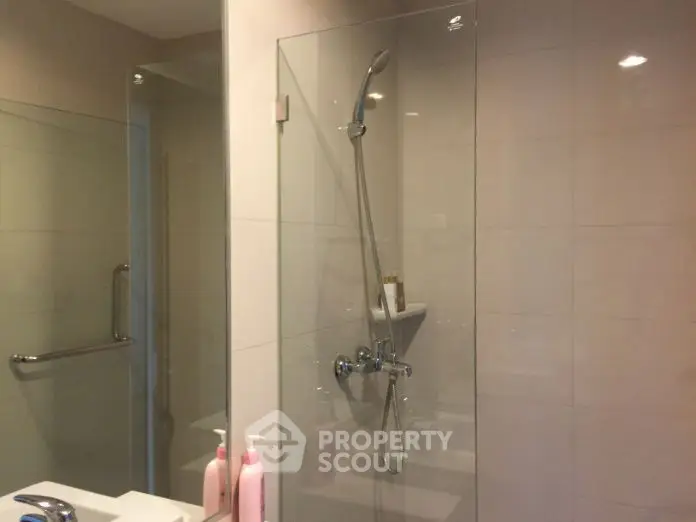 Modern bathroom with glass shower and sleek fixtures