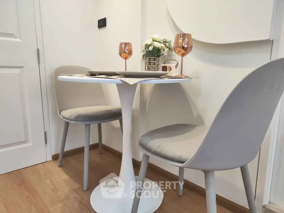 Chic dining nook with modern table and chairs, perfect for cozy meals.