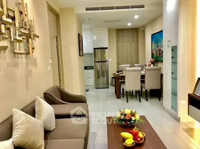 Elegant living room with modern dining area and stylish decor