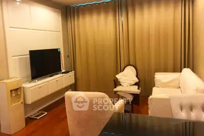 Cozy living room with elegant furniture and modern TV setup