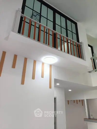 Modern interior with high ceiling and stylish wooden accents