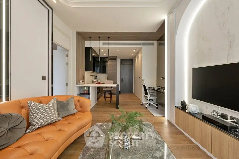 Modern open-plan living room with stylish decor and sleek kitchen area