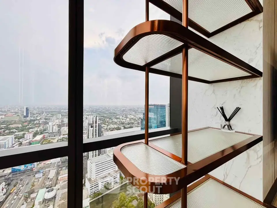 Stunning city view from a modern high-rise apartment with stylish shelving.