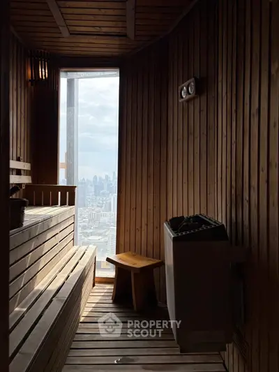Luxurious sauna with panoramic city view, featuring wooden interior and modern design.