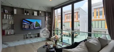 Modern living room with large windows and stylish decor