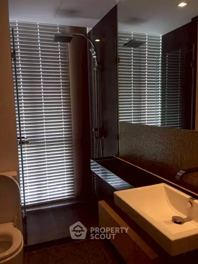 Modern bathroom with sleek design and glass shower enclosure