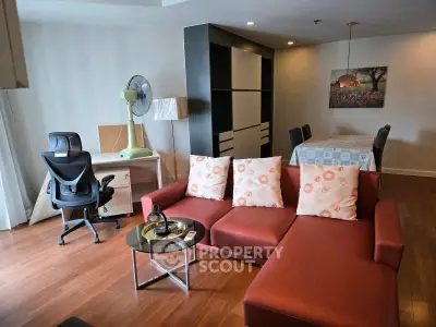 Spacious living room with modern furniture and elegant decor, perfect for relaxation and entertaining.