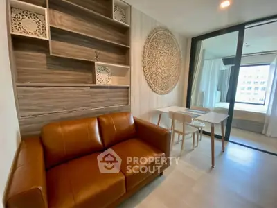 Modern living room with stylish decor and leather sofa in a contemporary apartment.