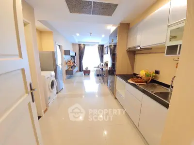 Modern kitchen with sleek cabinetry and open layout in a bright apartment