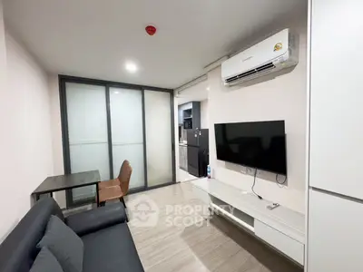 Modern living room with sleek design, featuring a wall-mounted TV and air conditioning.
