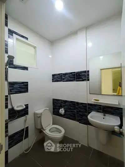 Modern bathroom with sleek tiles and contemporary fixtures