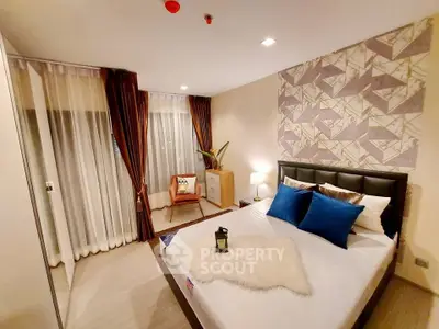 Luxurious bedroom with modern decor and large windows in a stylish apartment.